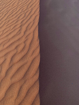 Abstract texture of boundless yellow and brown sand dunes