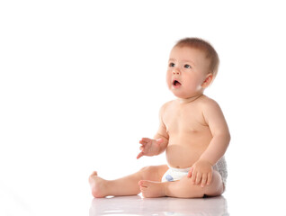 Cute little baby in diaper clapping hand on floor