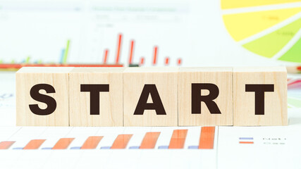 word start made with letters on wooden blocks on table