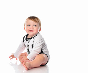 Portrait of infant child baby boy toddler with blue eyes on a white background.