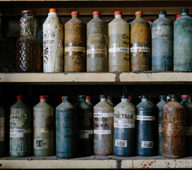 Shelf with different chemical products for metal treatment