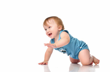 Infant child baby boy crawling and happy looking, isolated on a white background.