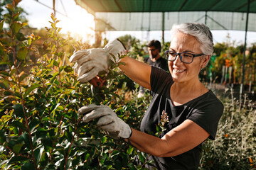 Happy mid adult couple working in the orchard