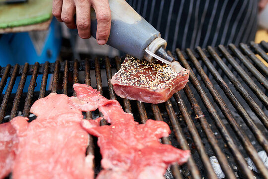 Grilled tuna being marinated