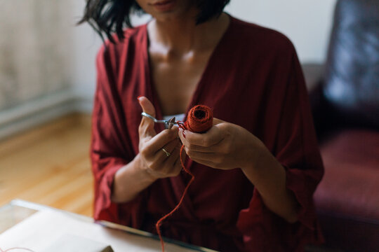 Woman wrapping Christmas gifts indoor