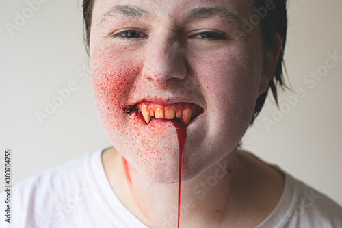 Portrait of a teenage vampire at Halloween