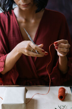 Woman wrapping Christmas gifts indoor