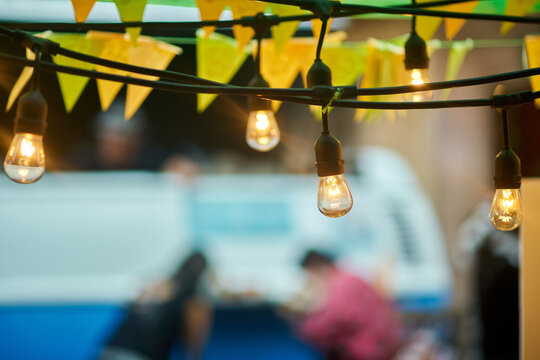 Light bulbs garland hanging at farmers market
