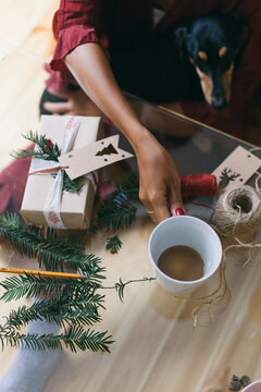 Woman having a morning coffee on a Christmas morning