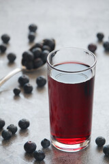 Fototapeta na wymiar A glass full of blueberry juice