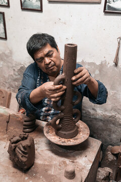 Mexican Artisan Sculpting With Mud