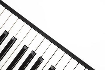 black and white piano or synthesizer keys isolated on white background, concept of music,