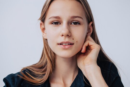 Headshot portrait of charming girl wearing black