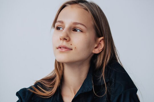 Headshot Portrait Of Charming Girl Wearing Black