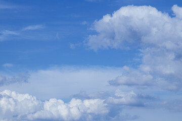 Blue sky with dramatic cumulus clouds.
