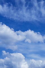 Naklejka na ściany i meble Blue sky with dramatic cumulus clouds.