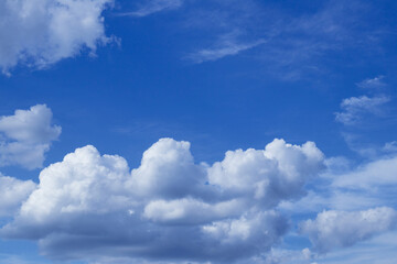 Blue sky with dramatic cumulus clouds.