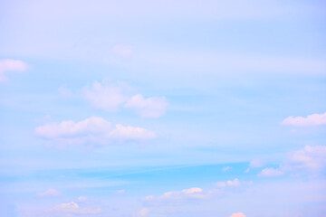 Light blue sky with white clouds - background