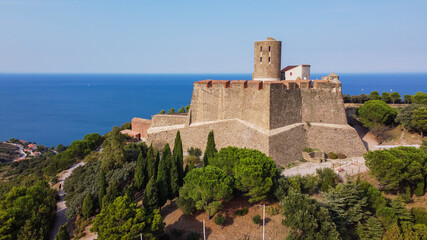 Fototapeta na wymiar Aerial view of the Fort Saint Elme above the town of Collioure in the south of France - Star shaped medieval fortress built on a hilltop over the Mediterannean Sea in the Catalan country
