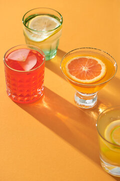 Alcoholic cocktail row on table