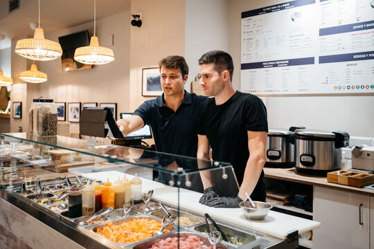 Restaurant young managers are checking the online orders