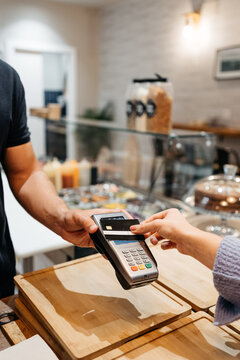Anonymous client paying with a credit card at a restaurant