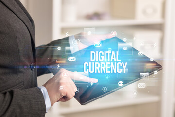 Close-up of a tablet searching DIGITAL CURRENCY inscription, modern technology concept