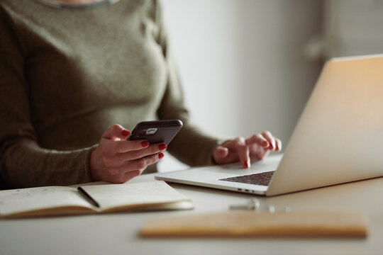Girl using gadgets at workplace