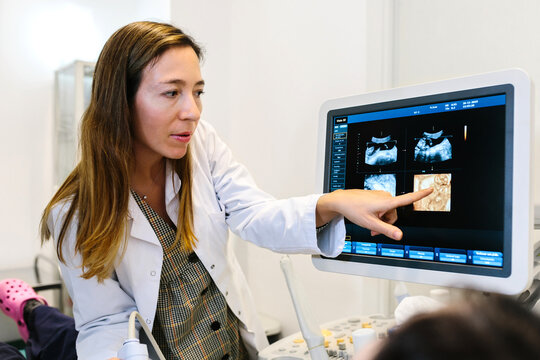 Female doctor performing a vaginal ultrasound to a patient