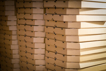 many paper pizza packs lie on top of each other. background. copy space