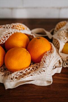 Oranges and lemons in a reusable bag