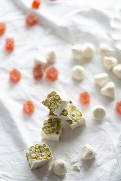 Torrone with pistachio, coconut meringue and grapefruit jelly cube