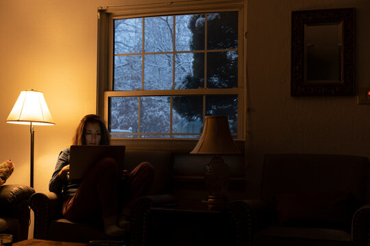 Woman looking at screen on a snowy winter day