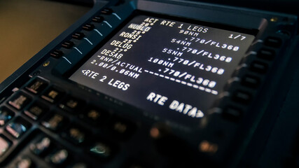 Barcelona, Spain - April 12, 2019 Close up of a flight management computer input and display. Modern jet airliner avionics in detail - obrazy, fototapety, plakaty