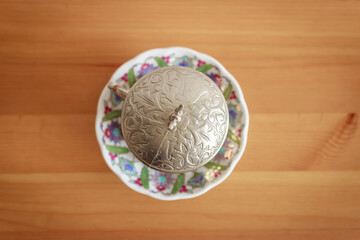 Top view of Turkish tea in traditional glass on wooden table