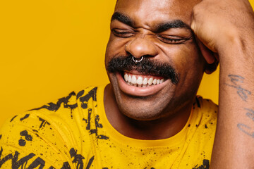 Happy african american man over yellow background