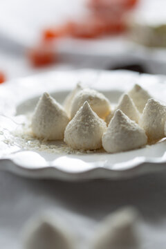 Torrone with pistachio, coconut meringue and grapefruit jelly cube