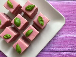 Pink punch cubes cake or Punsch donuts is a Austrian style sweet dessert.
