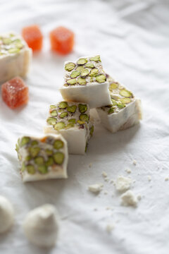 Torrone with pistachio, coconut meringue and grapefruit jelly cube