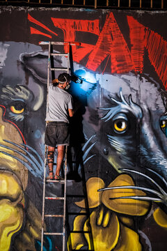 Graffiti artist painting