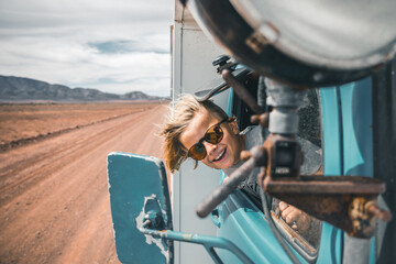 happy boy looking out of truck