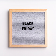 Text black friday on gray letter board on white background