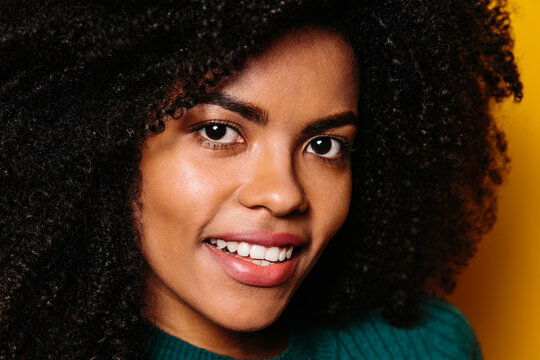 Happy beautiful afro woman smiling