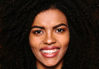 Happy beautiful afro woman smiling