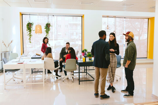 Diverse workers of open space office