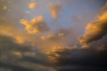 Orange stormy sunset with a clouds