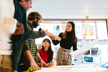 Contemporary smiling people in work process