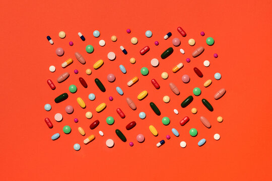 Pills against orange background