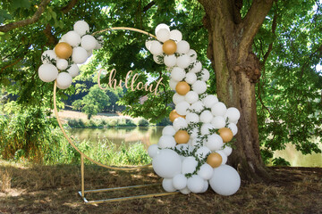 modern wedding arch, inflatable balloons. inscription in gold chillout.