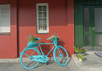 Fototapeta na wymiar Bicycle near traditional Scandinavian house, Norway